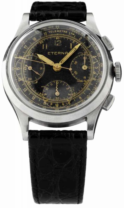 Chronograph "Eterna"Um 1940. Stahlgehäuse. Boden gedrückt. Schwarzes, signiertes Zifferblatt.