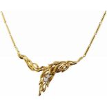 Collier "Gilbert Albert"Gelbgold 750, gestempelt "Gilbert Albert". 3 Brillanten, zusammen ca. 0.20