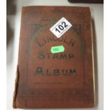 Stamp album containing many old English stamps