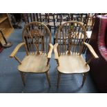 2 wheel back carver chairs