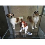 Three dog figures