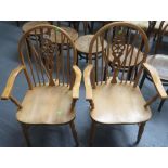 Two wheel back carver chairs