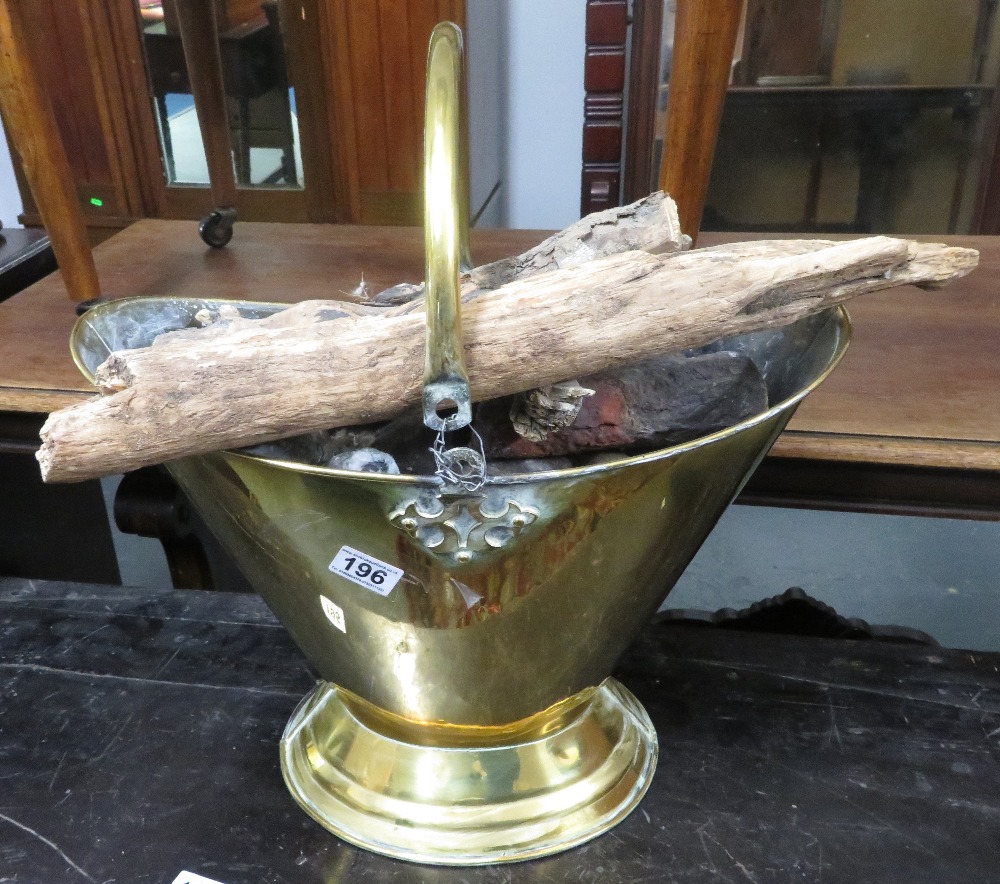 Brass coal bucket with logs