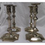 Set of four 11" London hallmarked H.E and Co Ltd silver candlesticks