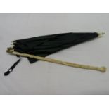 Highly carved ivory handle with silk parasol