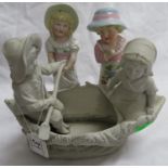 Parian ware figures in a boat and two other figures - possibly German