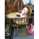 Child's high chair with doll