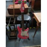 Pink guitar and stand