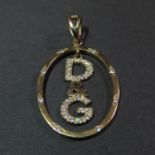 D & G diamond set pendant