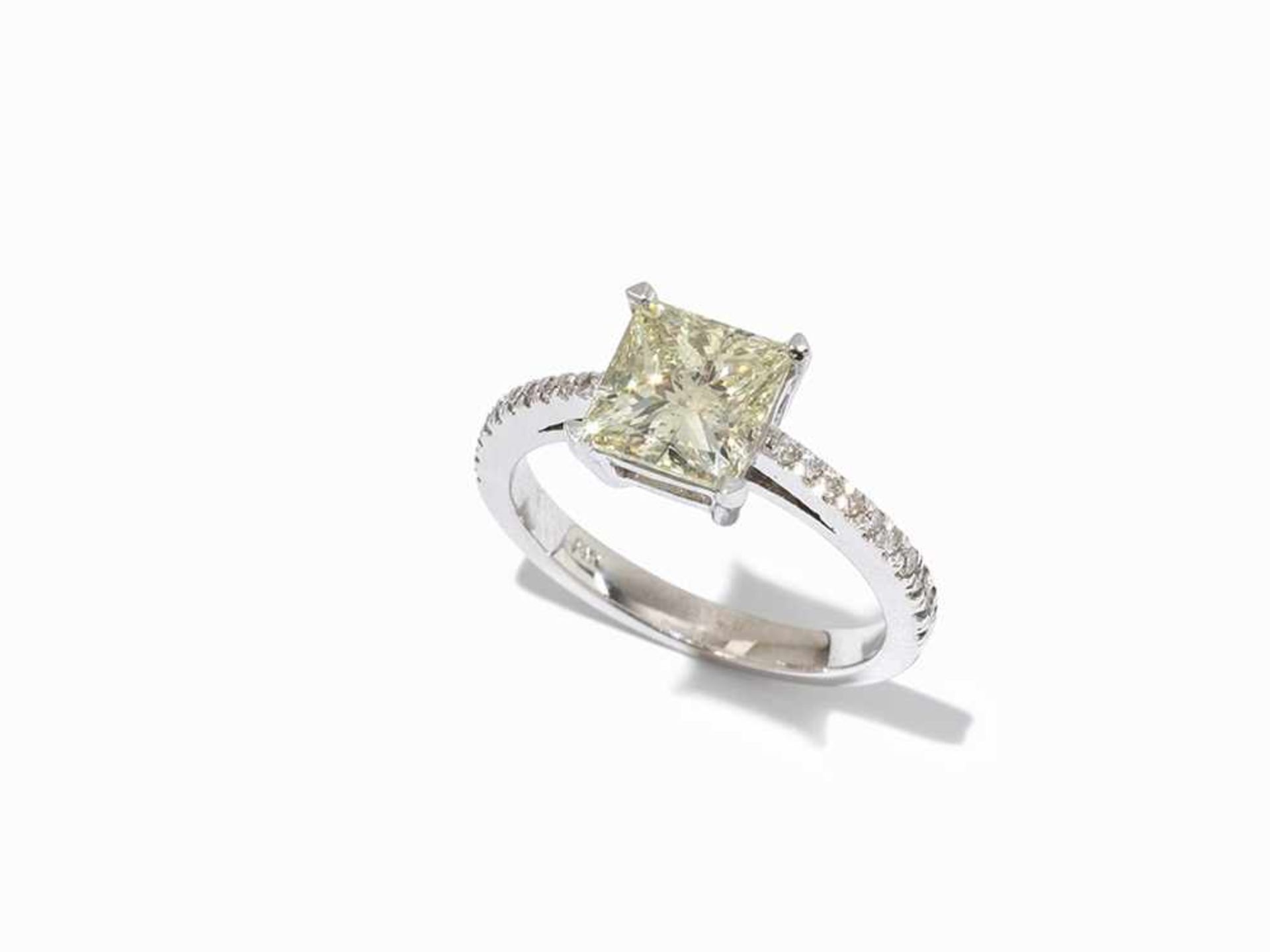 A Diamond Ring with Central Princess Cut Solitaire, 14K Gold 14 karat white gold One princess cut