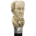 A LATE 19TH CENTURY SUBSTANTIAL WALKING CANE, the ivory pommel carved as the bust of William