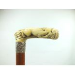 A LATE 19TH/EARLY 20TH CENTURY WALKING STICK, the ivory handle carved as an eagle fighting a dog,