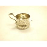 A small Russian silver cup, 1876, engraved with alternating panels of foliage, 6cm high, 2.5ozt.