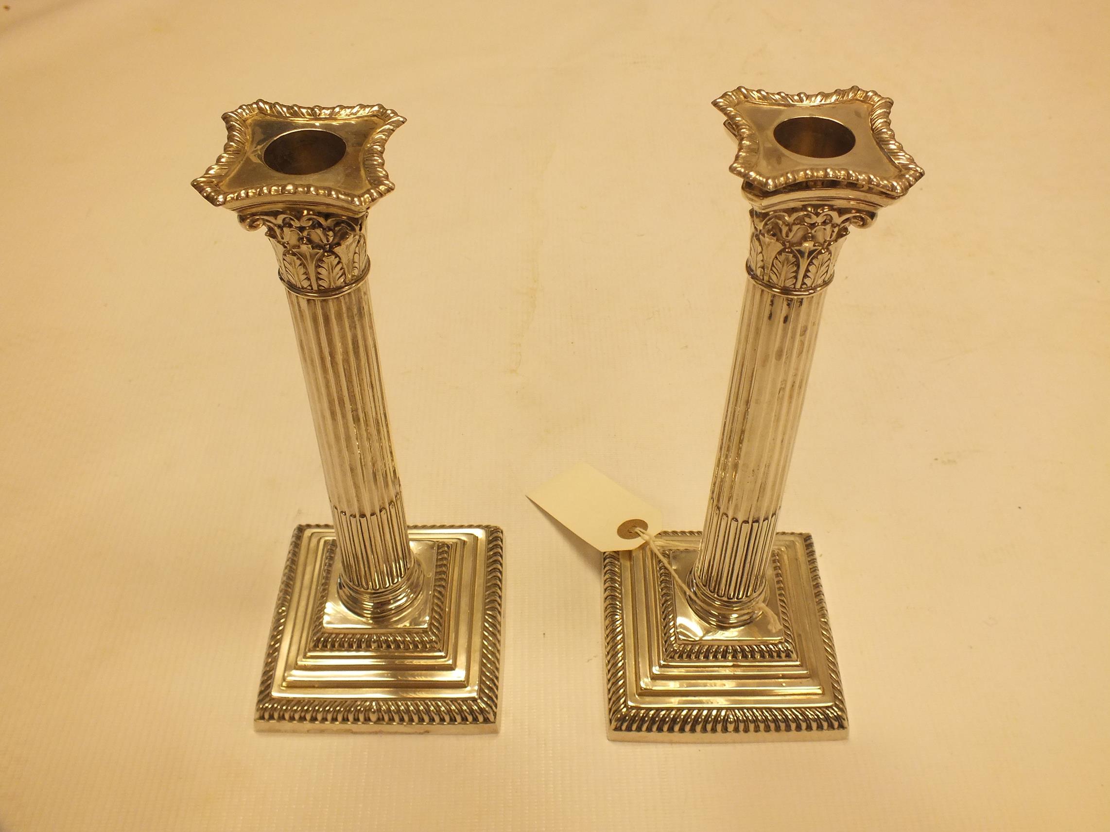 A pair of Victorian silver candlesticks by Mappin & Webb, Sheffield 1899, the detachable sconces