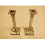 A pair of Victorian silver candlesticks by Mappin & Webb, Sheffield 1899, the detachable sconces