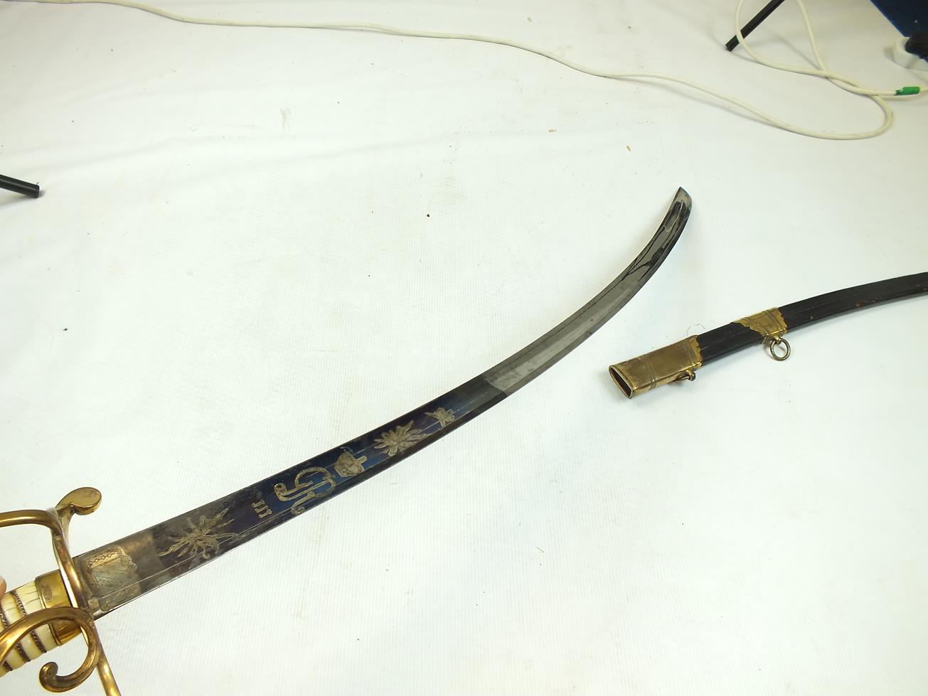 A GEORGIAN LIGHT COMPANY OFFICER'S SWORD, 82.5cm curved blade decorated with stands of arms, crowned - Image 15 of 21