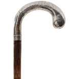 A WALKING STICK WITH SILVER HANDLE, the handle engraved with foliate scrolls and hallmarked