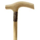 AN EARLY 20TH CENTURY WALKING STICK, the whole of marine ivory, the handle of plain form above