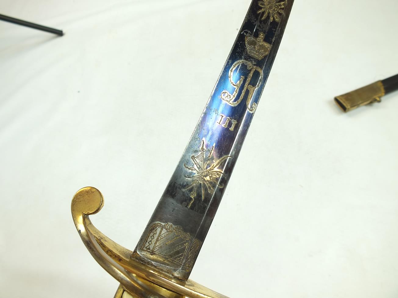 A GEORGIAN LIGHT COMPANY OFFICER'S SWORD, 82.5cm curved blade decorated with stands of arms, crowned - Image 16 of 21