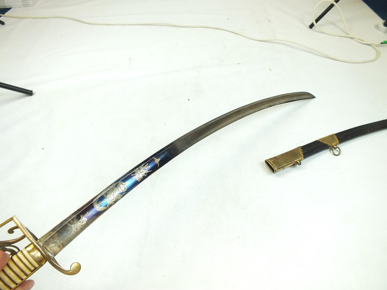 A GEORGIAN LIGHT COMPANY OFFICER'S SWORD, 82.5cm curved blade decorated with stands of arms, crowned - Image 14 of 21