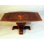 Art Deco table on central foot with four bowed side foot; the top in bowed rectangular shape; walnut