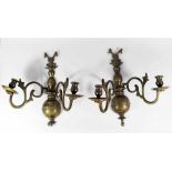 Pair of polish bronze wall brackets, each with two branches decorated with open work and scrolls,