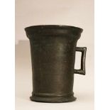 Gothic bronze mortar with one hand grip, rounded base and outstanding upper border; bronze cast with