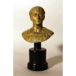 Bronze bust of Roman emperor Augustus in ancient manner, looking to the side, in armour; bronze cast