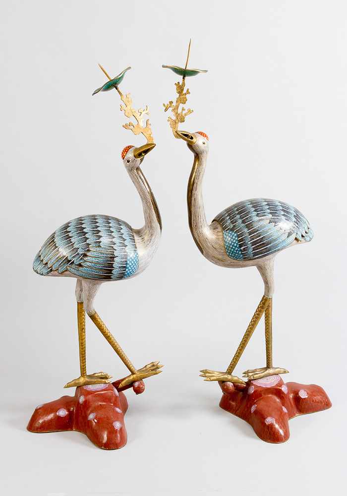 Pair of imperial cranes, on naturalistic bases in shape of tree stunks; each crane with a branch