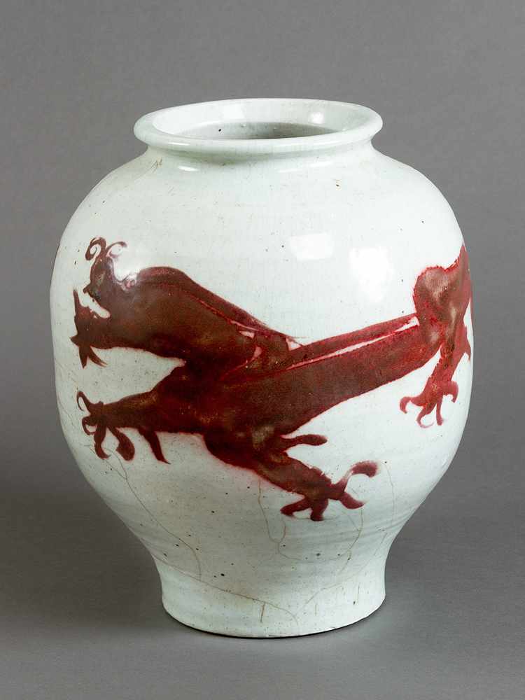 Chinese porcelain pot, white painted with red dragon ornament, short neck and wide border; glazed;