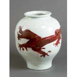 Chinese porcelain pot, white painted with red dragon ornament, short neck and wide border; glazed;