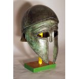 Corinthian bronze helmet in ancient style with open work eyes and nose protection, chased border
