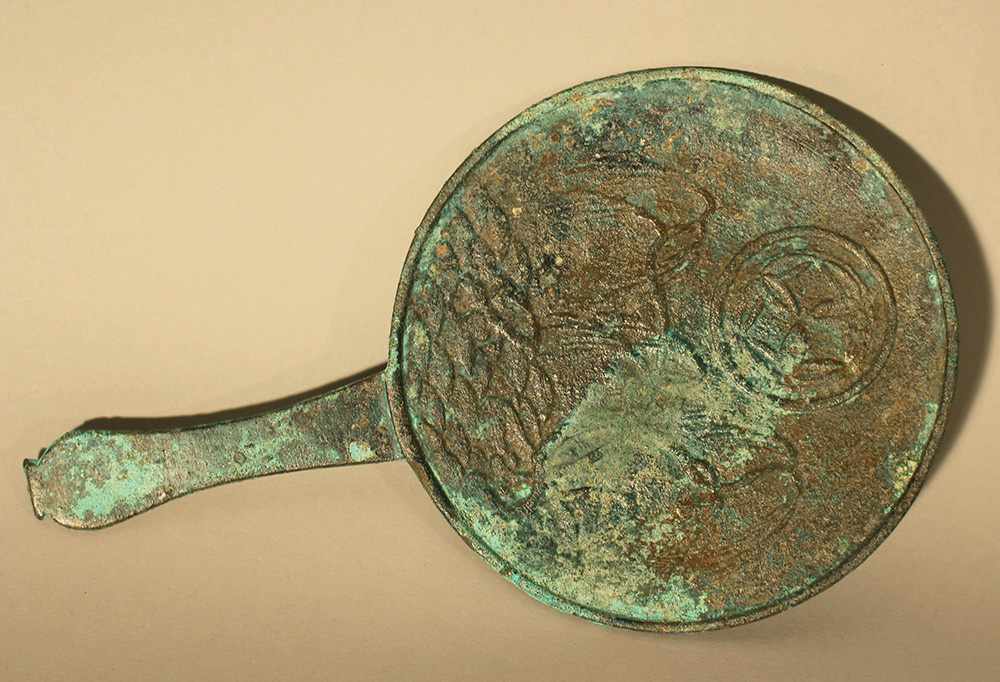 Asian bronze mirror or presentoire, very fine cast with hand grip, border ring and plants on a hill,