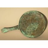 Asian bronze mirror or presentoire, very fine cast with hand grip, border ring and plants on a hill,
