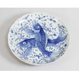 Japanese porcelain dish with blue painted fishers and decorations on white ground, glazed; waved