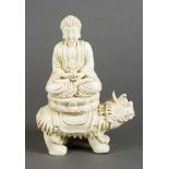 Blanc-de-Chine porcelain sculpture of Buddha sitting in lotus shaped seat, with a pot for the