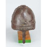 A early Iron Helmet with arched shape, with four iron fields crossed with two iron bands and