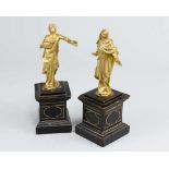 A pair of manieristic bronze sculptures of Maria in folded dress spreading the arms and St. joseph