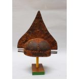 Iron helmet in Archaic style, with three round iron sticks on each side and nob decorations on the