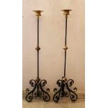 Pair of Spanish Iron Lighters, tripod base with scrolled iron ornaments, central iron collumn with