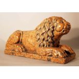 Rosso Verona Stone reclining Lion, on rectangular base in a realistic style with waved hair, some