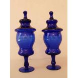 Pair of blue Glass Goblets, each with lid and long standing feed bowed and curved shape partly
