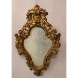 Italian Mirror, in pear shape with rich wood carved floral decorations, partly in open work, stepped