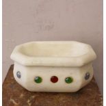 Small italian marble bassin, in octagonal and waved shape, with color glass stones, on white