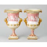 Pair of Berlin porcelain Vases, in urn shape on central feet and quadratic base, fluted in the