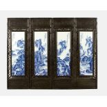 Four Chinese Panels, with rectangular exotic carved wood panels, in the centre each with blue on