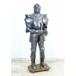 A knights Armour in medieval style, iron work with collapsible and moveable parts and decorations,