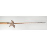 Halberd, with canted peak and open work central part, iron forged, partly rusty, on later wooden