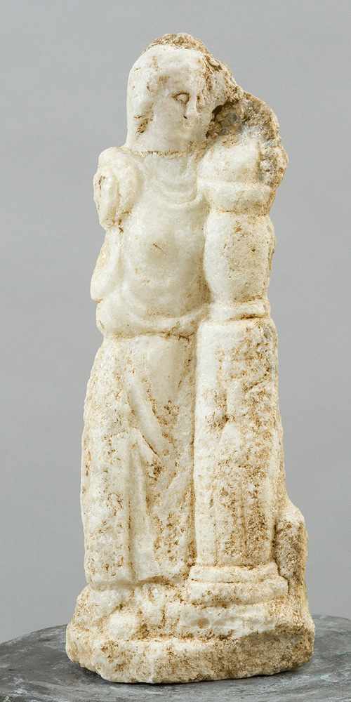 Possibly ancient standing sculpture, Torso showing a standing female next to a column with a vase of