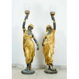 Pair of Belle Epoque Bronze Torcheres, showing two oriental ladies each holding a lamp in the hand